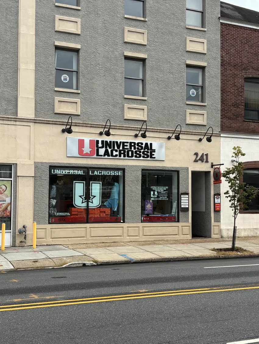 Close view of the ground-floor storefront and building entrance marked 241